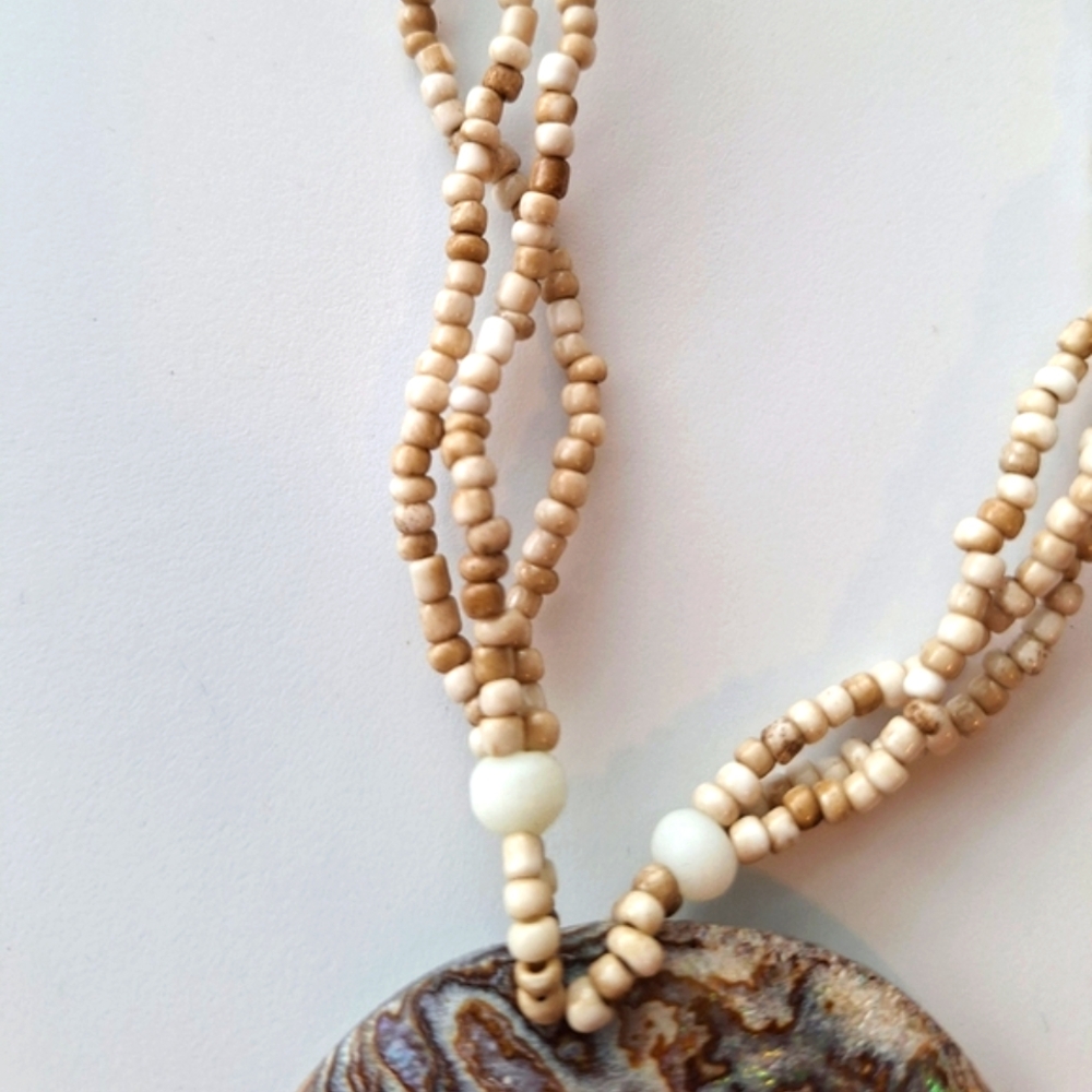 Elegant Beaded Necklace with Earthy Shell Pendant - Picture 3 of 3